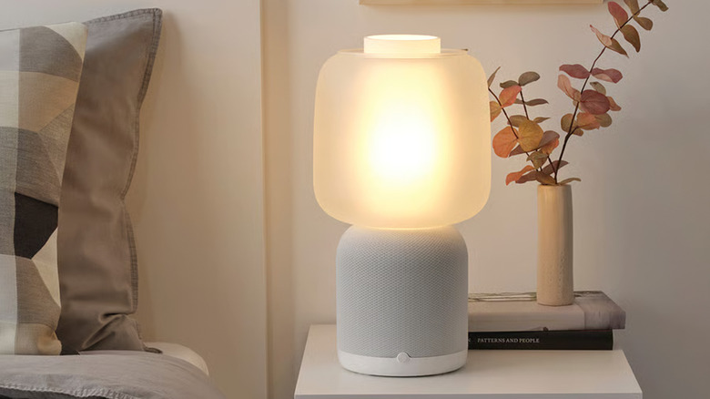 An Ikea Symfonisk lamp speaker on a night stand