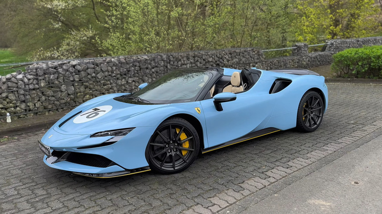 A side on shot of a parked Ferrari SF90 Spider