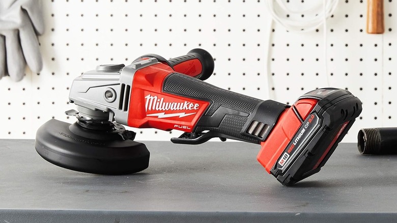 Milwaukee 2780-20 M18 Fuel Cordless Angle Grinder on a bench