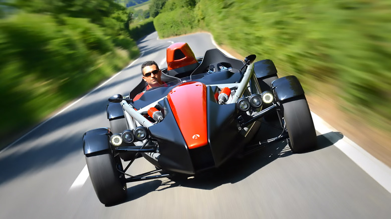 A black and red 2018 Ariel Atom 4 driving