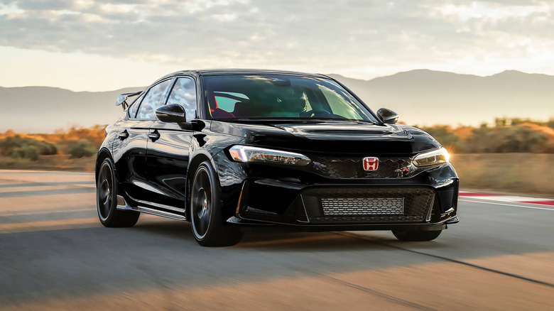 A black 2025 Honda Civic Type R driving