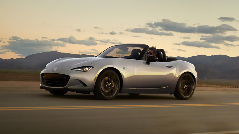 A silver 2025 Mazda MX-5 Miata driving