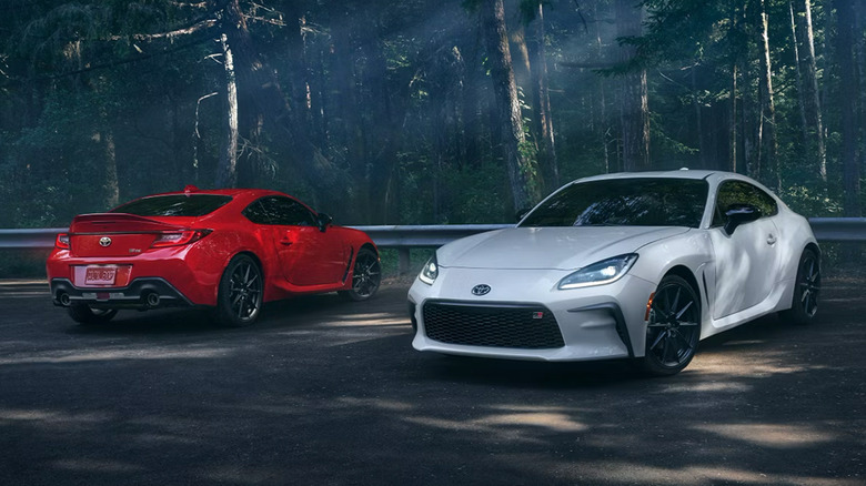 A white 2025 Toyota GR86 next to a red 2025 Toyota GR86
