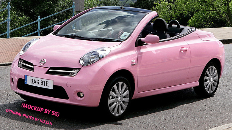 A Pink Nissan Micra C+C parked on a deck
