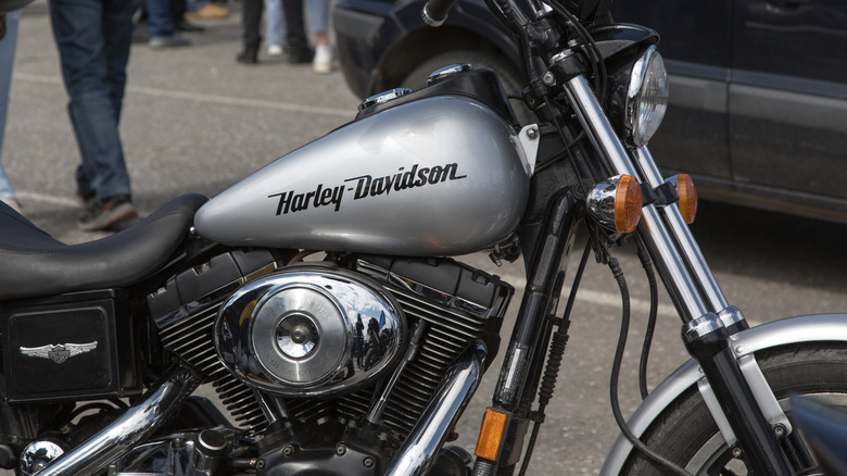 A silver Harley-Davidson bike with the 88 cubic inch engine parked.