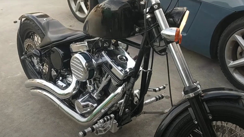 A custom silver chopper with the Ultima 127 engine running.