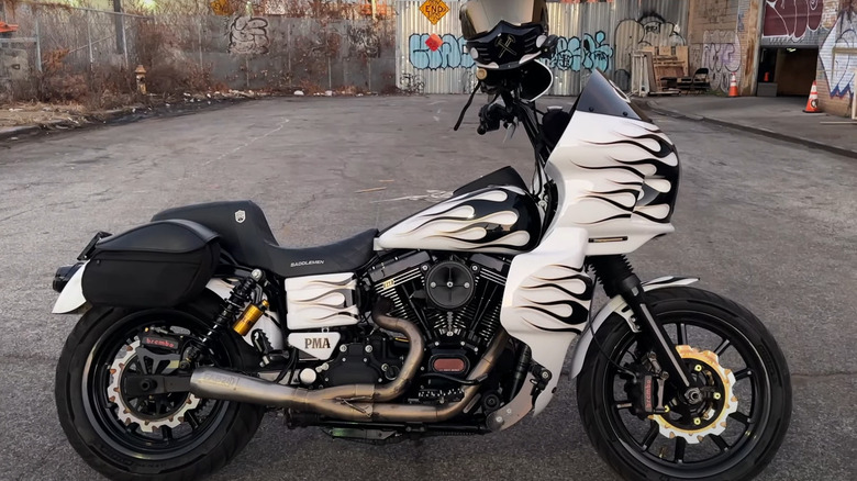 A white Harley-Davidson bike parked in a lot with the S&S V124 engine