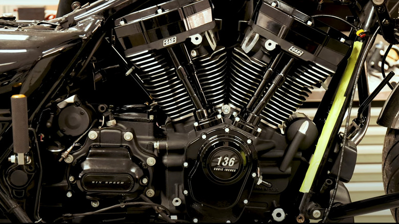 A cose up shot of the gloss black S&S MK136 M8 sitting on a factory workbench