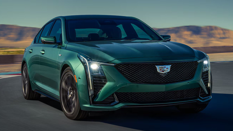 Green Cadillac CT5-V Blackwing cornering on a race track
