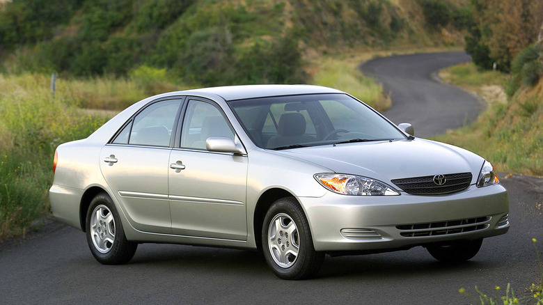 A silver 2002 Toyota Camry parked