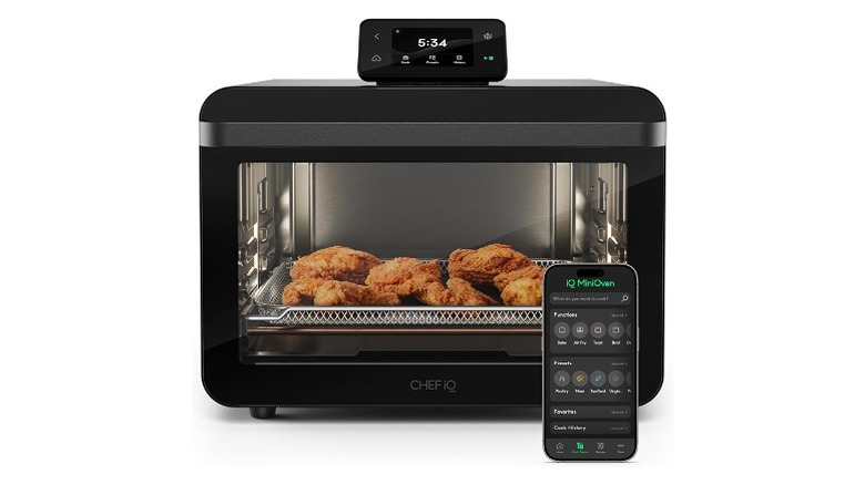 Black microwave with meat inside