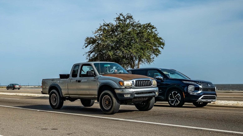 Older model Toyota Tacoma on a highway