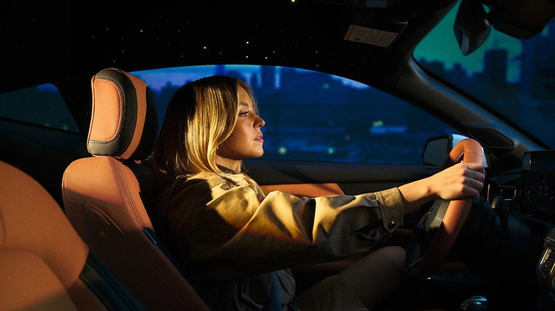 Sydney Sweeney driving a Ford vehicle