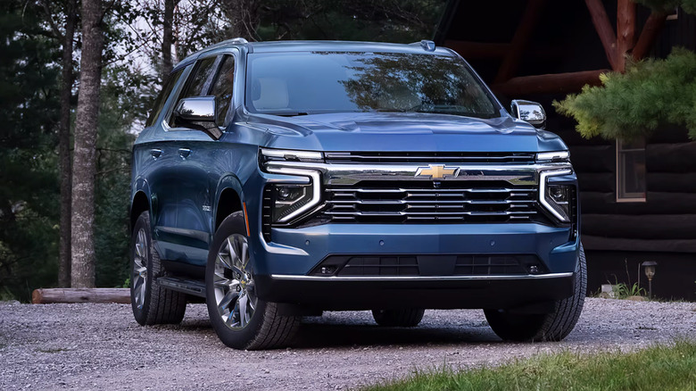 A blue 2025 Chevrolet Tahoe parked