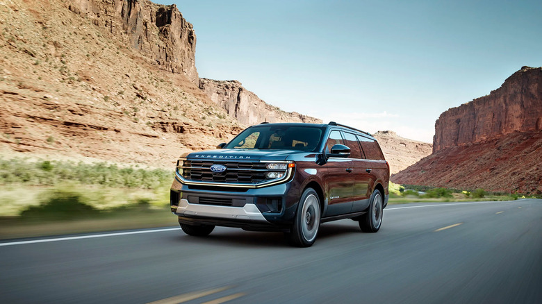 A dark blue 2025 Ford Expedition driving
