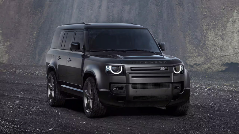 A black 2025 Land Rover 130 parked