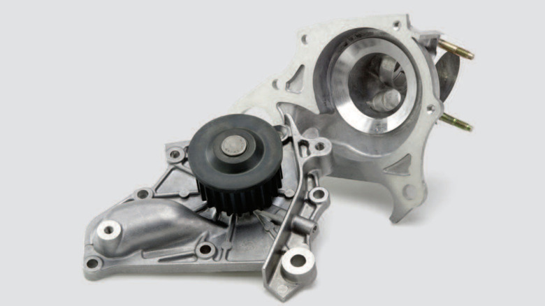 A close-up of an AISIN water pump against a white background.