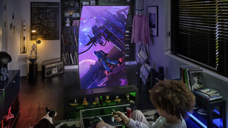 Teenager watching a vertical curved TV.