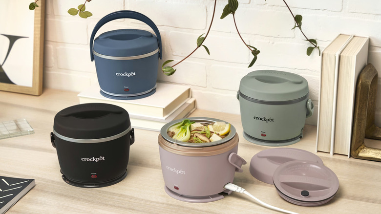 Various small Crock-Pot lunch crocks on a table.