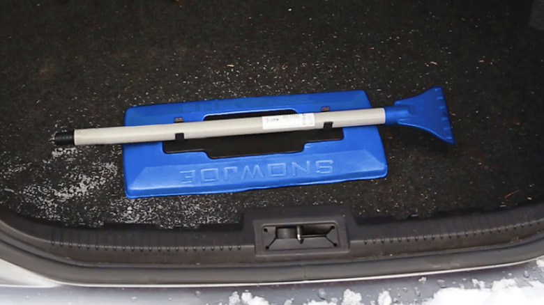 Snow Joe Foam Head Telescoping Snow Broom + Ice Scraper on display