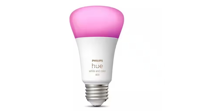 White smart bulb illuminated in pink