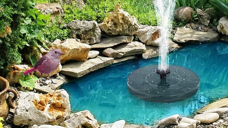 Mademax 1W Solar Bird baths shooting out water and birds.