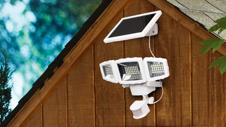 Westinghouse LED 2000 Lumen Solar Security Light with Triple Head on a barn.