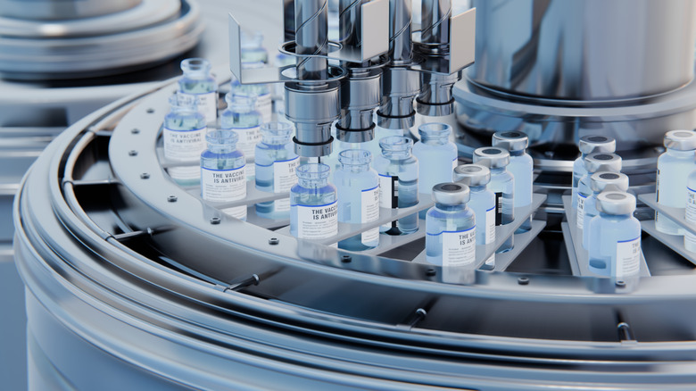 An image representing drugs bottles being filled by a machine.