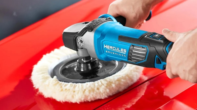 using the Hercules polisher on a red car.