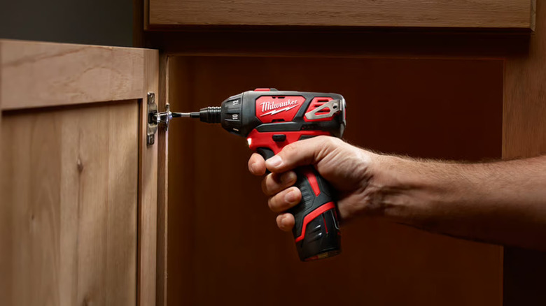Milwaukee cordless screwdriver tightening a screw