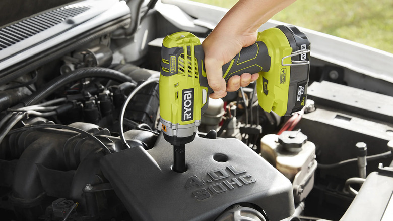 Working on a car with a Ryobi impact wrench