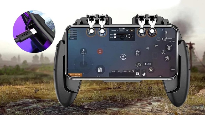 Analog game pad triggers with a smartphone installed.