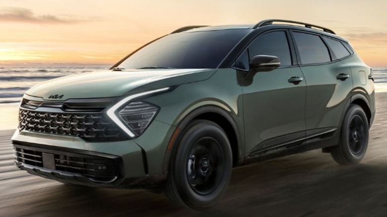 2025 Kia Sportage driving on beach