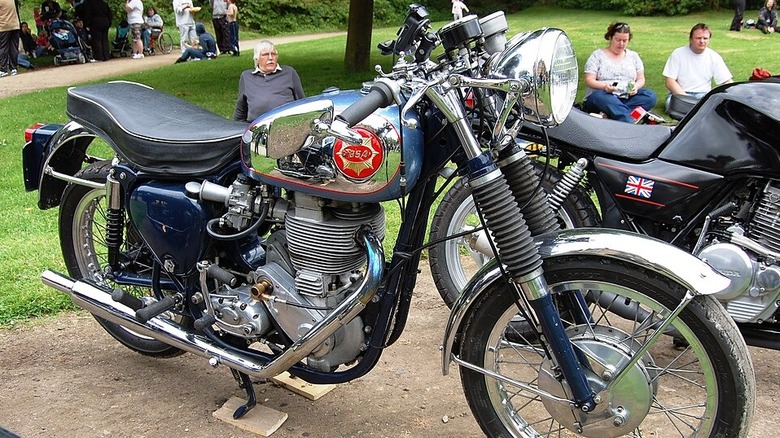 Vintage BSA motorcycle on display in a field