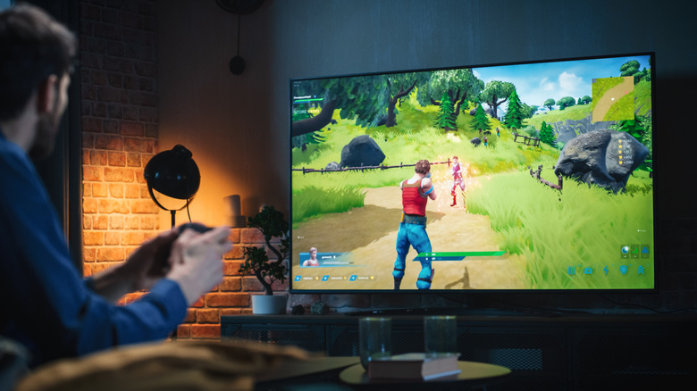 A person gaming on a TV