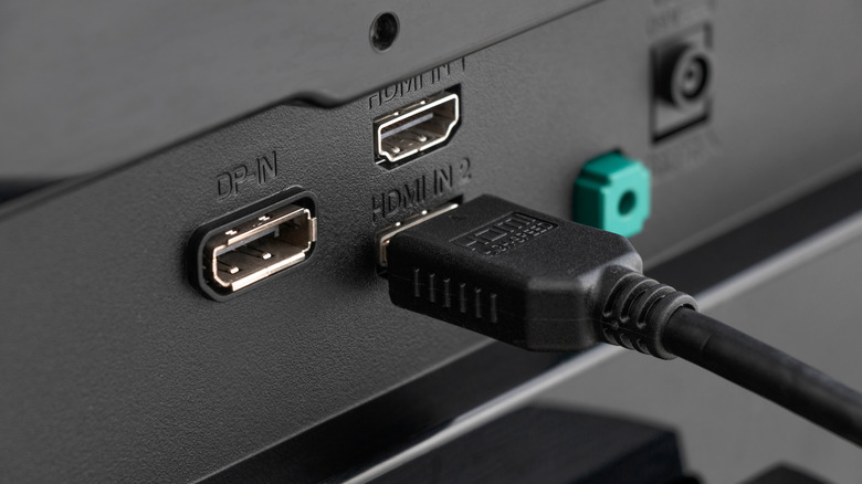 An HDMI cable inserted into a TV