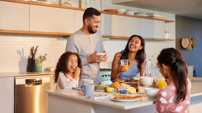 A family eating in the kitchen