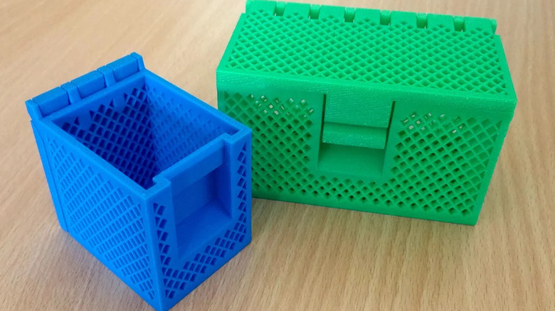 Two 3D printed storage boxes with hinged lids