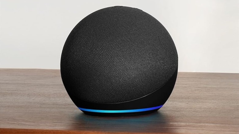 The Amazon Echo Dot smart speaker on a desk.