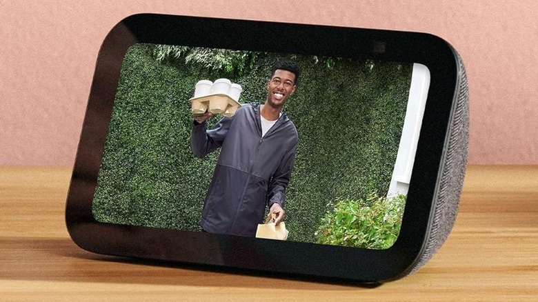 An Amazon Echo Show 5 smart display shows a smart home camera feed.