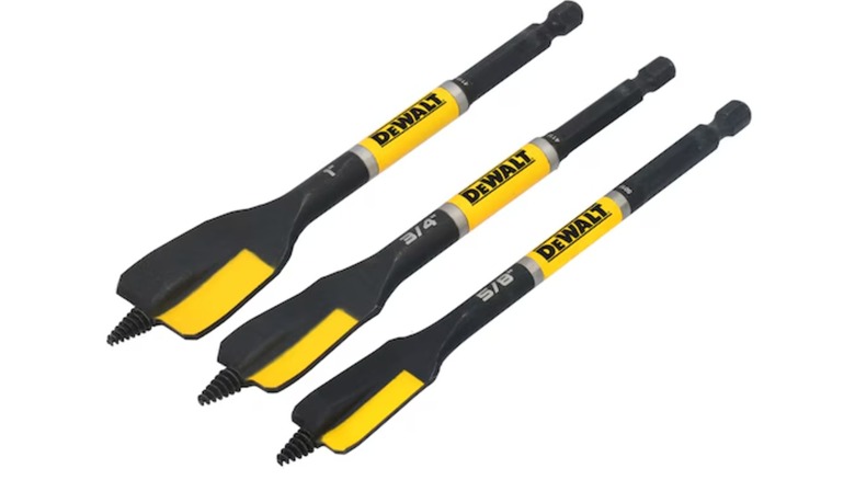 A set of three black and yellow DeWalt spade bits on a white background