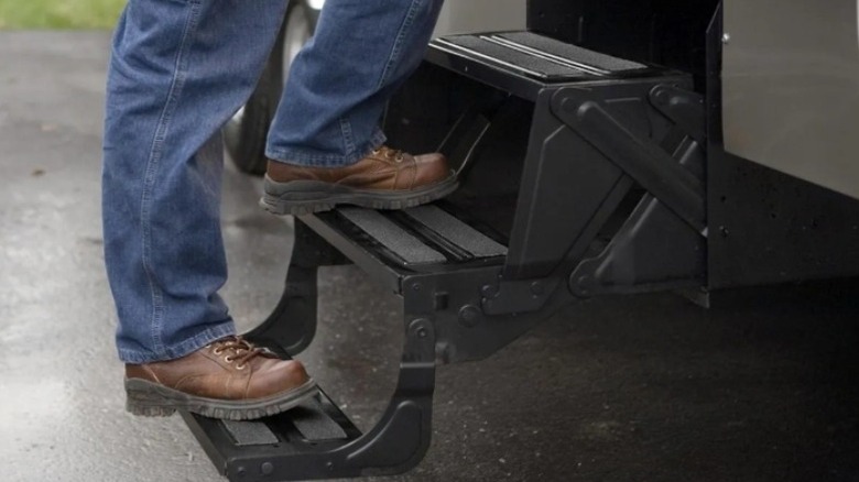 Man stepping up an RV ladder