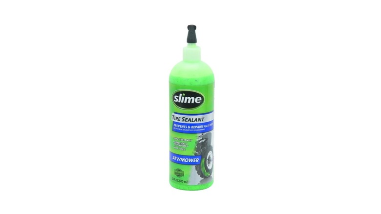 Bottle of Slime tire sealant on a white background