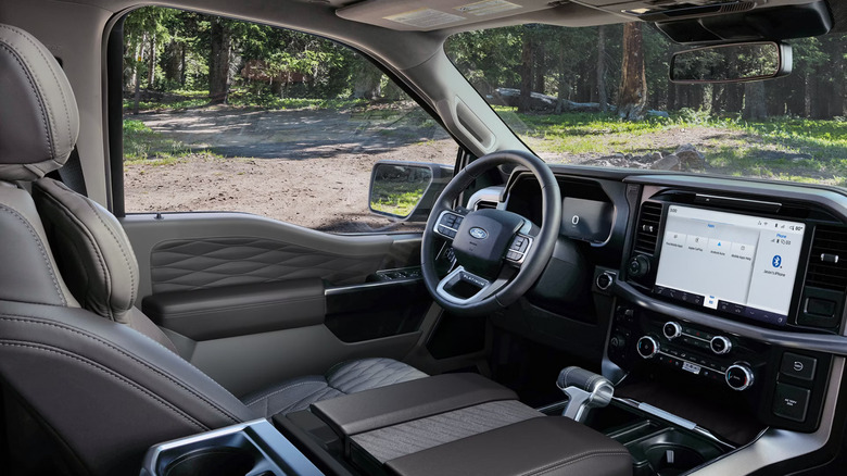The interior of the new 2026 Ford F-150 finished in beige, from the right door.