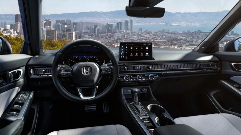 The minimalist yet classy black and silver interior of the 2026 Honda Civic, finished in black.
