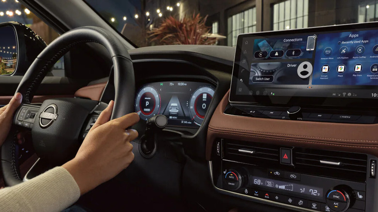 The 2026 Nissan Rogue interior finished in the signature "rock creek" theme, shown from the passenger seat.
