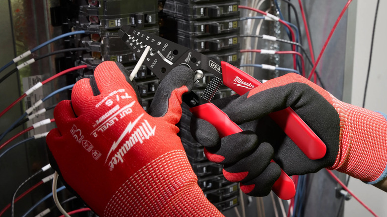Worker using a Milwaukee wire stripper/cutter