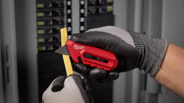 Milwaukee Multi-Function Compact Utility Knife in action