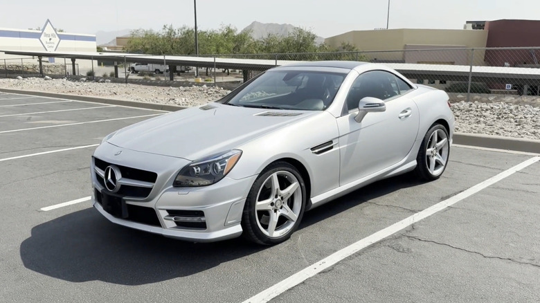 A front end shot of a silver 2012 Mercedes-Benz SLK-Class parked