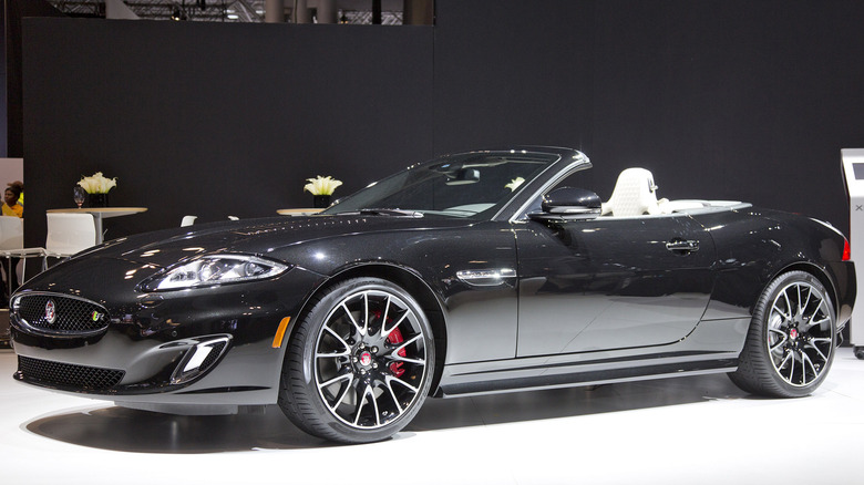 A side on shot of a black 2015 Jaguar XK on display